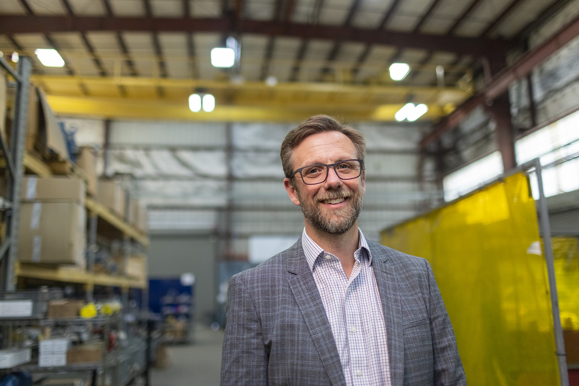 CEO, Daniel Voit posing for photo in Blentech manufacturing warehouse.