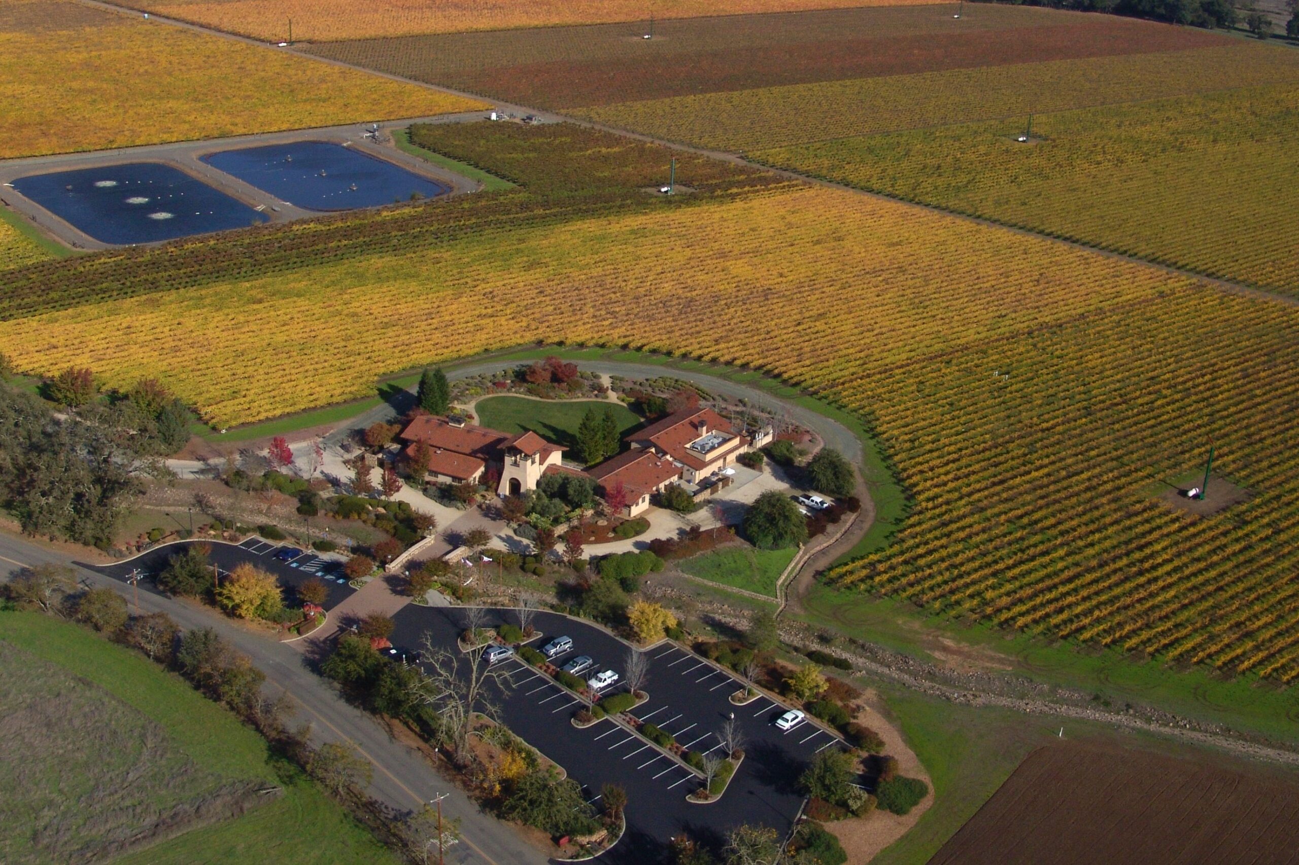 Ariel view of vineyards in the fall and winery sitting amongst them. Kenwood, CA